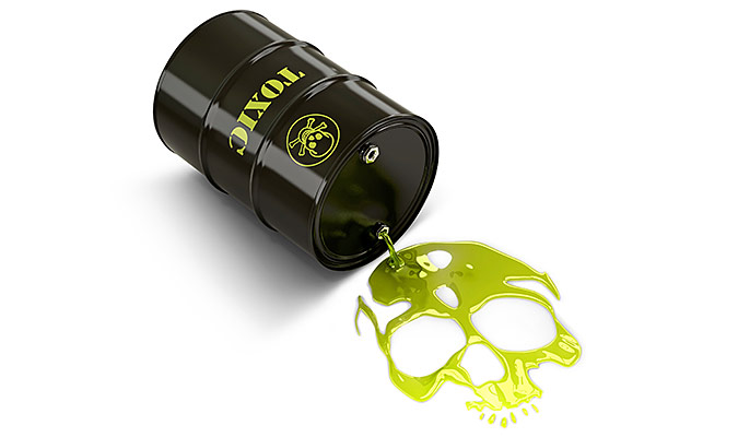 Barrel labelled 'toxic' spilling green goop into the shape of a skull.
