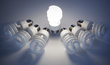 One lightbulb is lit among many that are dead.