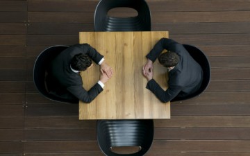 Overhead image of two men sitting at a table