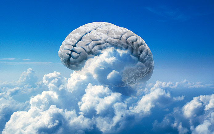 A brain in the sky surrounded by clouds