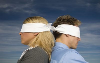 blindfolded-businesspeople-standing-back-to-back